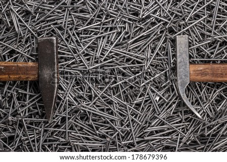 old hammers and nails on the table