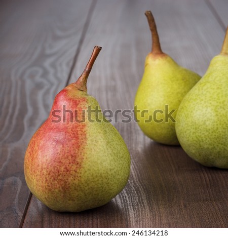 fresh pears on the brown wooden table