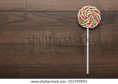 colorful sugar lollipop on the wooden table