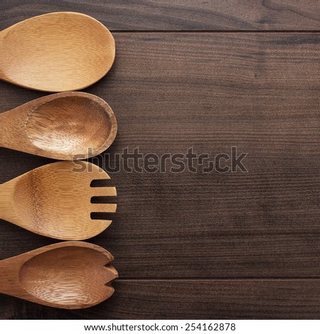 different wooden spoons on the blue table