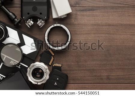 different video making equipment on brown wooden table