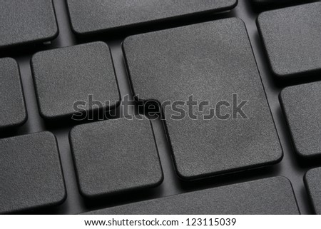 Detail of black computer keyboard without any letters on keys