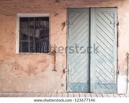 Front of a abandoned house with window and door