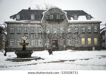 House with slate covered with snow in winter in Goslar, Germany