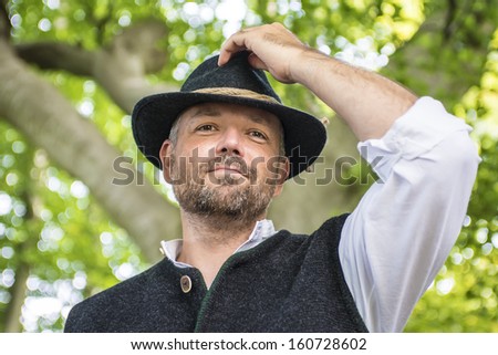 Portrait of happy man with traditional Bavarian costume