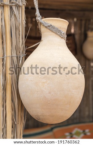 Hanging clay pot in desert camp Oman