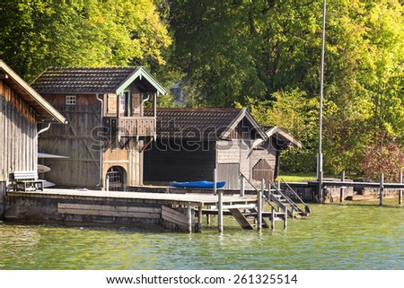 view to lakeside of lake Starnberg with cottage and landing stage on lake in Bavaria, Germany