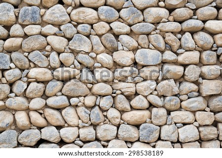 image of a wall with pebbles in sultanate oman middle east