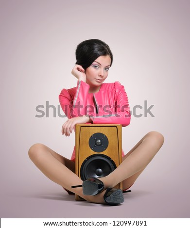 Elegant young woman with speaker, relax party concept