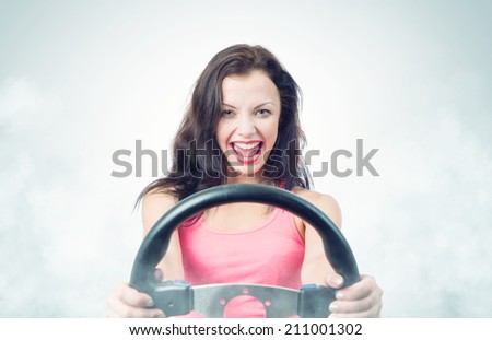 Funny girl with car wheel and smoke