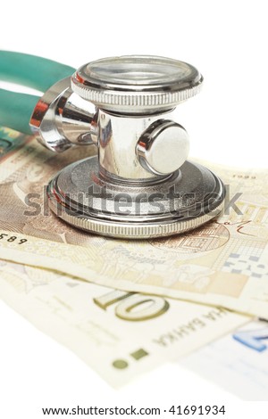Stethoscope on the top of the money. Selective focus on stethoscope. It could describe high cost of medicine or bribe in medicine.