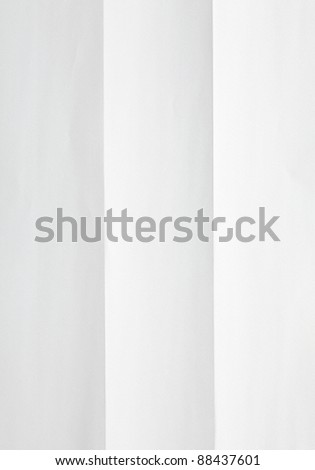 white sheet of textured paper folded in three