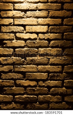 Old type brick wall texture front face with local lighting
