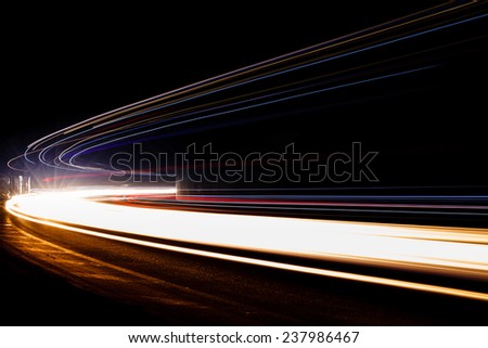 Light traillight trails in tunnel. Art image. Long exposure photo taken in a tunnel.