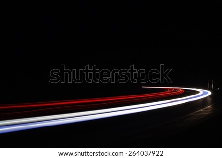Light traillight trails in tunnel. Art image. Long exposure photo taken in a tunnel.