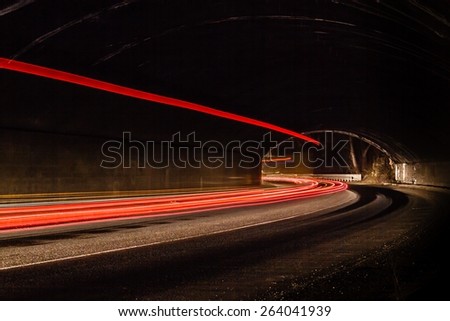 Light tralight trails in tunnel. Art image. Long exposure photo taken in a tunnel ils in tunnel.