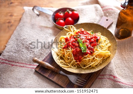 Spaghetti bolognese pasta with a tomato beef sauce on the oak Parmesan