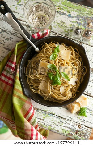 Pasta Spaghetti With Pesto Sauce On The Wooden Table
