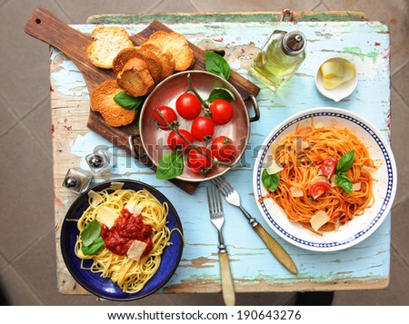 Italian spaghetti pasta dish bruschettÃ?Â?Ã?� �¡val, tomatoes and parmesan cheese - top view