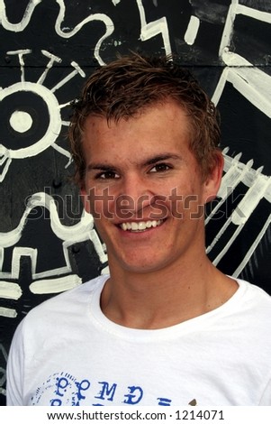 Young man smiling (black and white background)