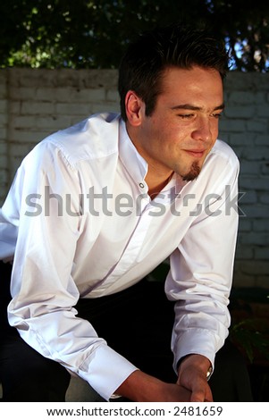 Man in white shirt thinking