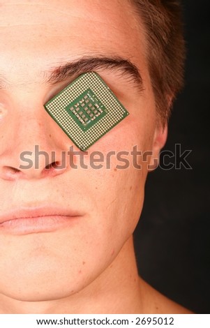Close Up of a Male Model With Computer CPU(Processor) Inbedded in his eye