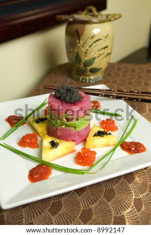 A Fresh Tuna Sushi Tower with Beluga and Salmon Caviar, as well as avocado and pineapple highlights