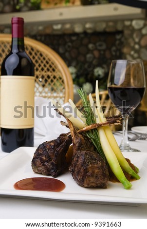 Lamb chops with vegetables in front of a fireplace