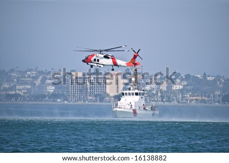 Coast Guard Jayhwak Helicopter hovering over search and rescue boat