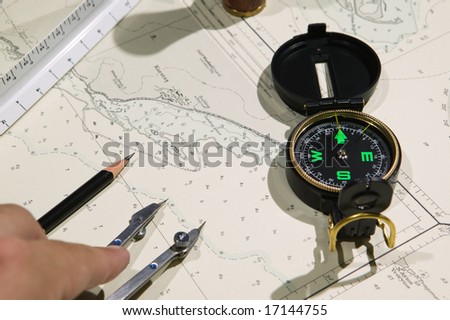 Navigational tools and compass on a nautical navigation map