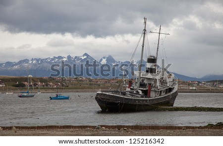 A harbor scene in Ushuaia, Argentina which is also called \'the end of the earth\' because it is the south most populated city in the world.