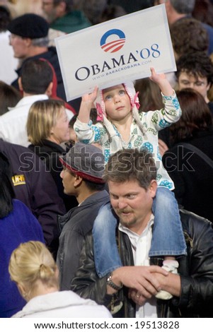 NEW MEXICO - OCTOBER 25: An unidentified child holds an “Obama ’08” sign while attending an Obama presidential rally at the University of New Mexico on October 25, 2008 in Albuquerque, New Mexico.