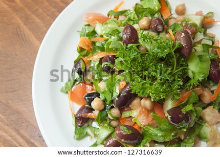 Greek style salad with a variety of vegetables.