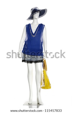 Full female dress with yellow  bag on mannequin
