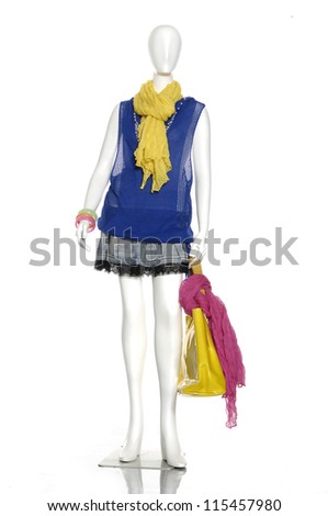 Full female clothes in scarf with bag on a mannequin