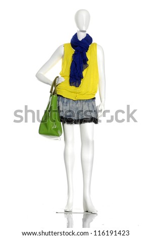 female clothing in bag with blue scarf on mannequin