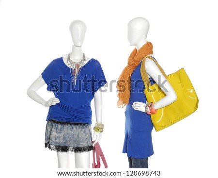 female clothing in jeans with scarf, bag on two mannequin
