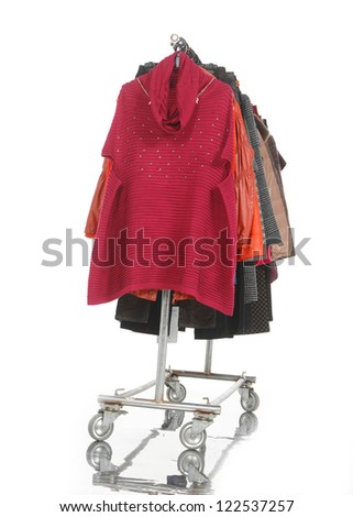 Set of coat clothes hanging on clothes rack