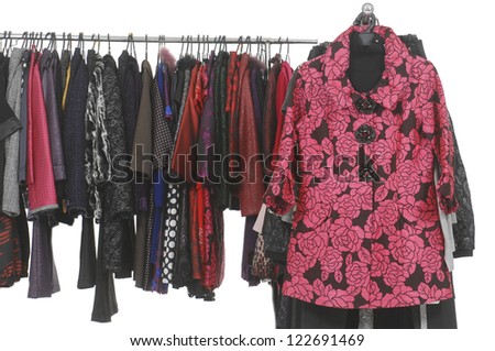 Set of female coat clothes hanging on clothes rack