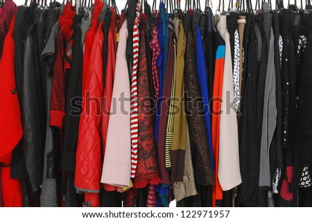 female clothes hanging on clothes rack