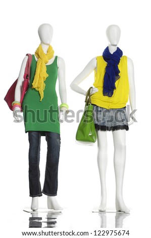 full-length female clothes in scarf with bag on a mannequin