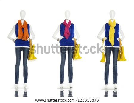 female clothes in jeans with yellow bag ,scarf on three  mannequin