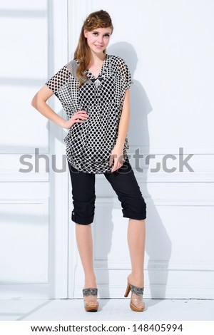full-length fashion model standing posing in studio