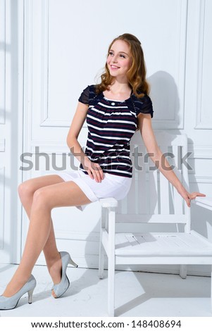 beautiful young smile woman sitting chair posing