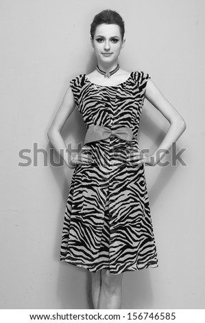 fashion shot of girl posing in studio shot black and whit