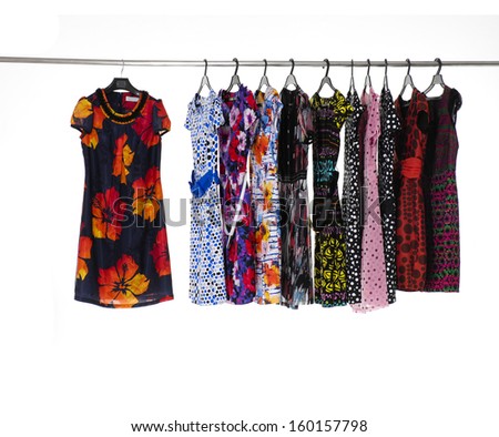 Set of female sundress clothes hanging on clothes rack
