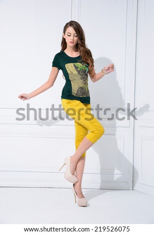 Full body portrait of a beautiful young female standing posing