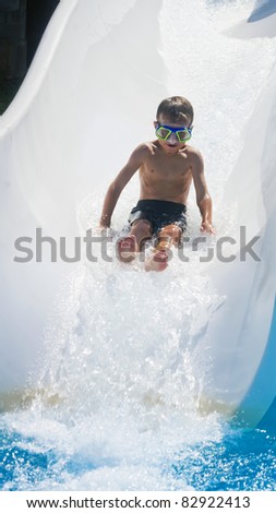 The boy is rolling with a water slide at a water park in Little Rock