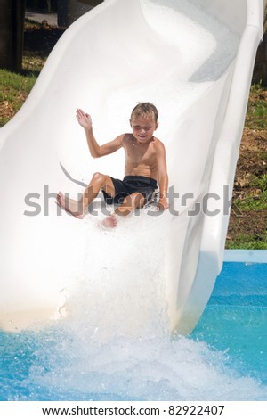 The boy is rolling with a water slide at a water park in Little Rock
