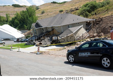 NORTH SALT LAKE (UT) / USA - august 8, 2014: A police car was destroyed by a landslide in the house